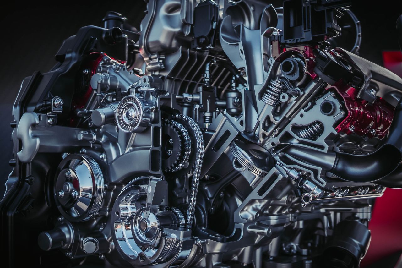 Mastering the First Impression: Your intriguing post title goes here Detailed close-up of a modern metallic car engine with intricate components.