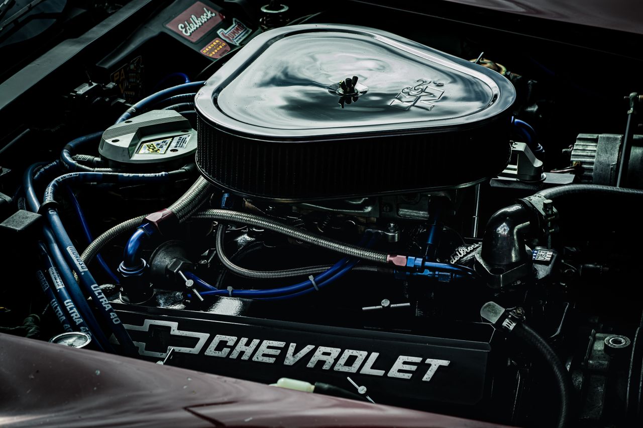 The Art of Drawing Readers In: Your attractive post title goes here Detailed close-up of a Chevrolet engine showcasing performance parts and intricate mechanics.
