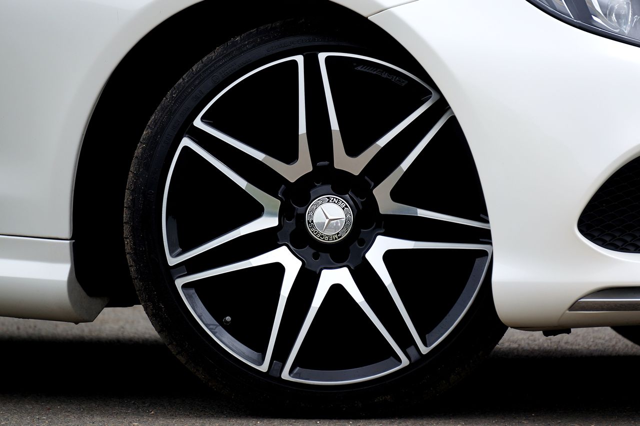 Crafting Captivating Headlines: Your awesome post title goes here Detailed view of a luxury car's sleek alloy wheel highlighting elegance and design.